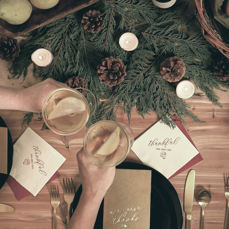 Hands cheering over a thanksgiving table